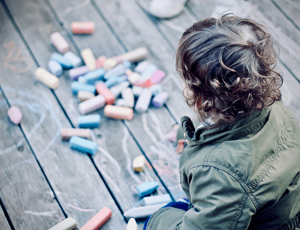 Child playing with chalk